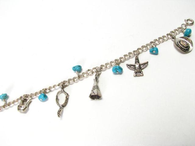 Appraisal: One Sterling Silver Charm Bracelet charms include cowboy hat thunderbird