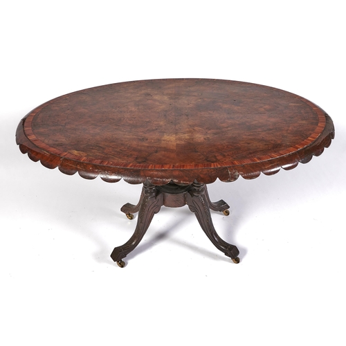 Appraisal: A Victorian walnut loo table the figured quarter veneered top