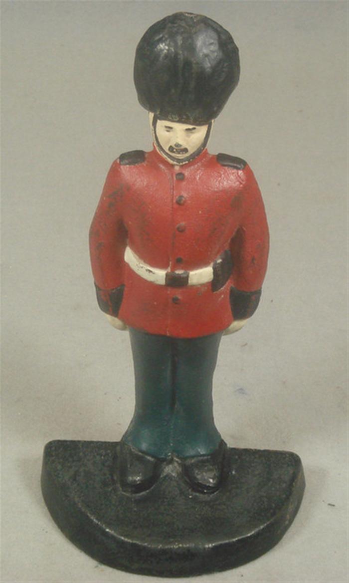 Appraisal: Cast iron doorstop large Buckingham Palace guard in full uniform