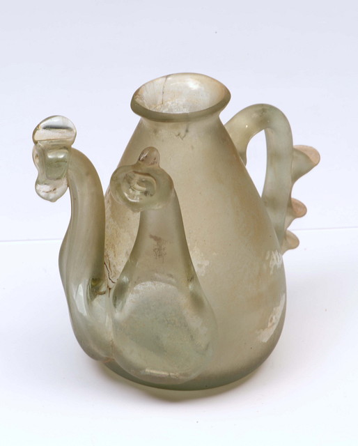 Appraisal: A MIDDLE EASTERN POSSIBLY SYRIAN TWIN SPOUTED BOTTLE of a