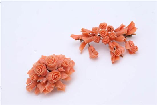 Appraisal: TWO CORAL PINS Victorian coral rosette brooches The large cluster