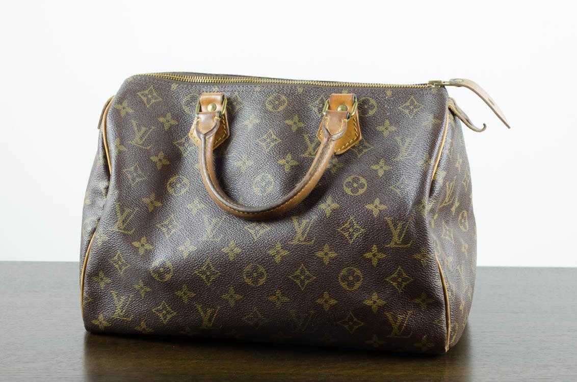 Appraisal: LOUIS VUITTON SPEEDY HANDBAG monogram canvas and leather handles Code