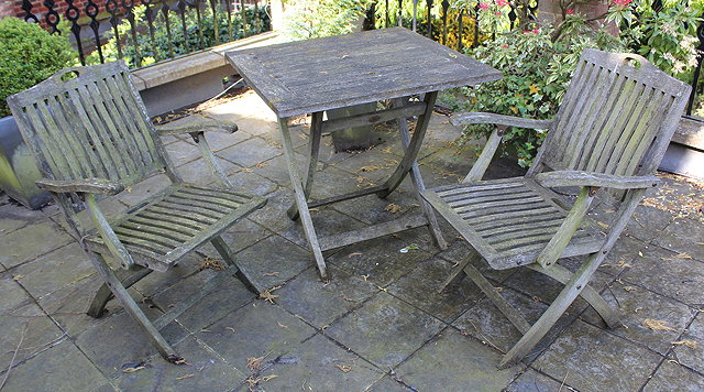 Appraisal: A PAIR OF TEAK FOLDING GARDEN ARMCHAIRS by David Pembroke