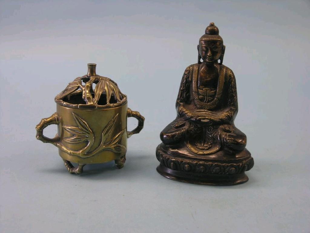 Appraisal: A Chinese bronze Buddha in and a Chinese bronze two-handled