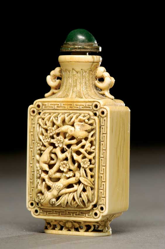 Appraisal: CARVED IVORY SNUFF BOTTLE Elaborately carved ivory snuff bottle of