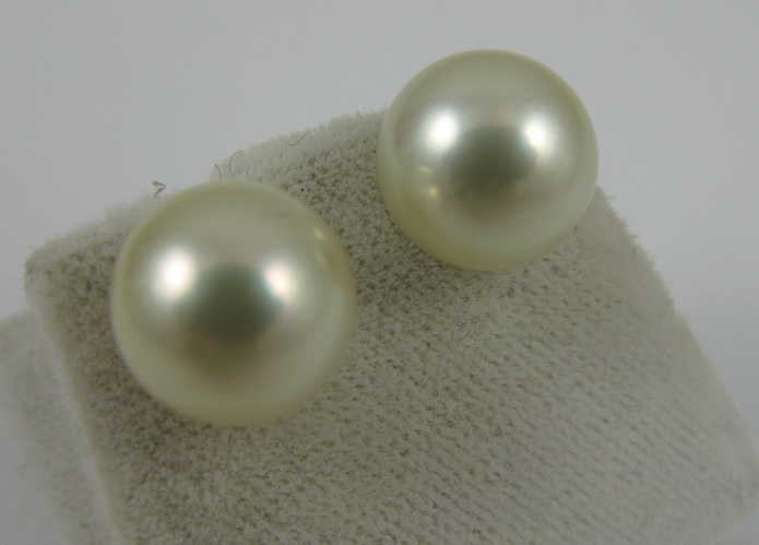 Appraisal: PAIR OF PEARL AND K GOLD EAR STUDS each set