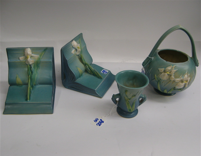 Appraisal: FOUR PIECES ROSEVILLE POTTERY in the Iris pattern pair bookends