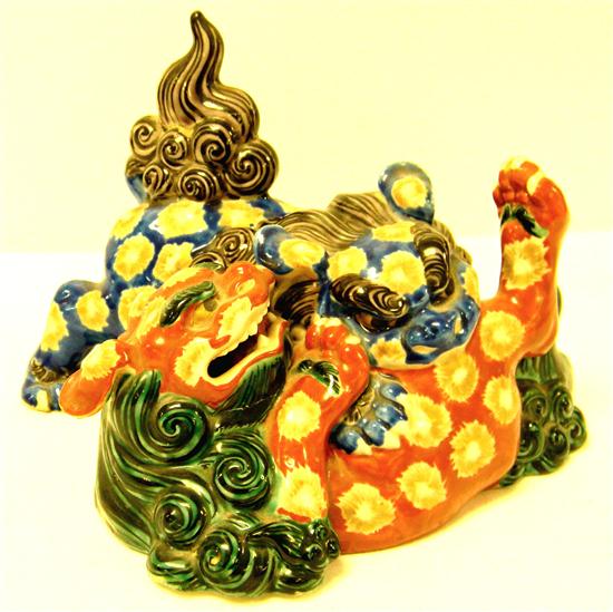 Appraisal: Japanese polychrome porcelain fighting foo dogs '' l one tail