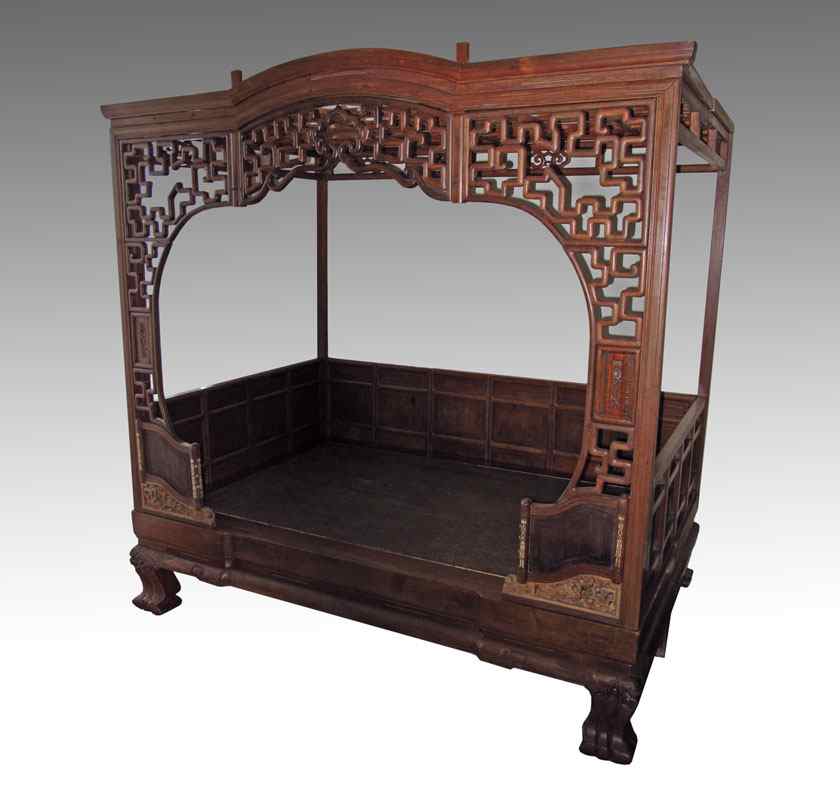 Appraisal: CHINESE CANOPY BED Posts supporting open fret panel canopy three