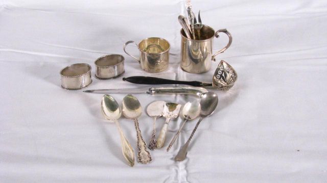 Appraisal: Collection of sterling silver items including small mug two napkins