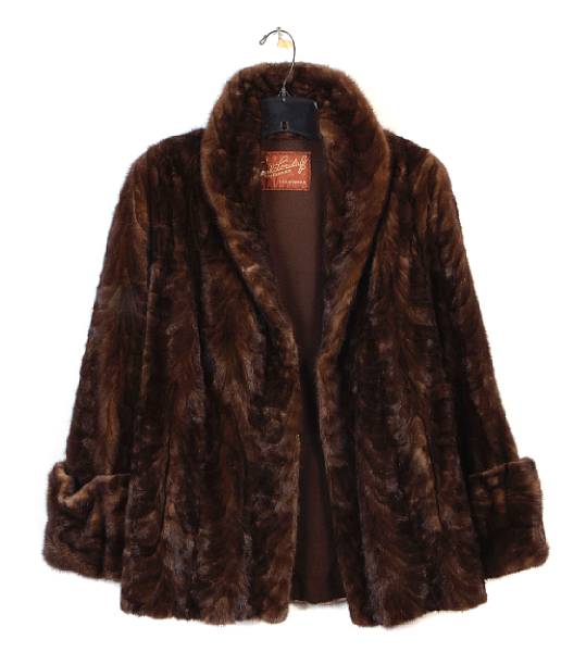 Appraisal: A group of five coats and wraps comprising three fur