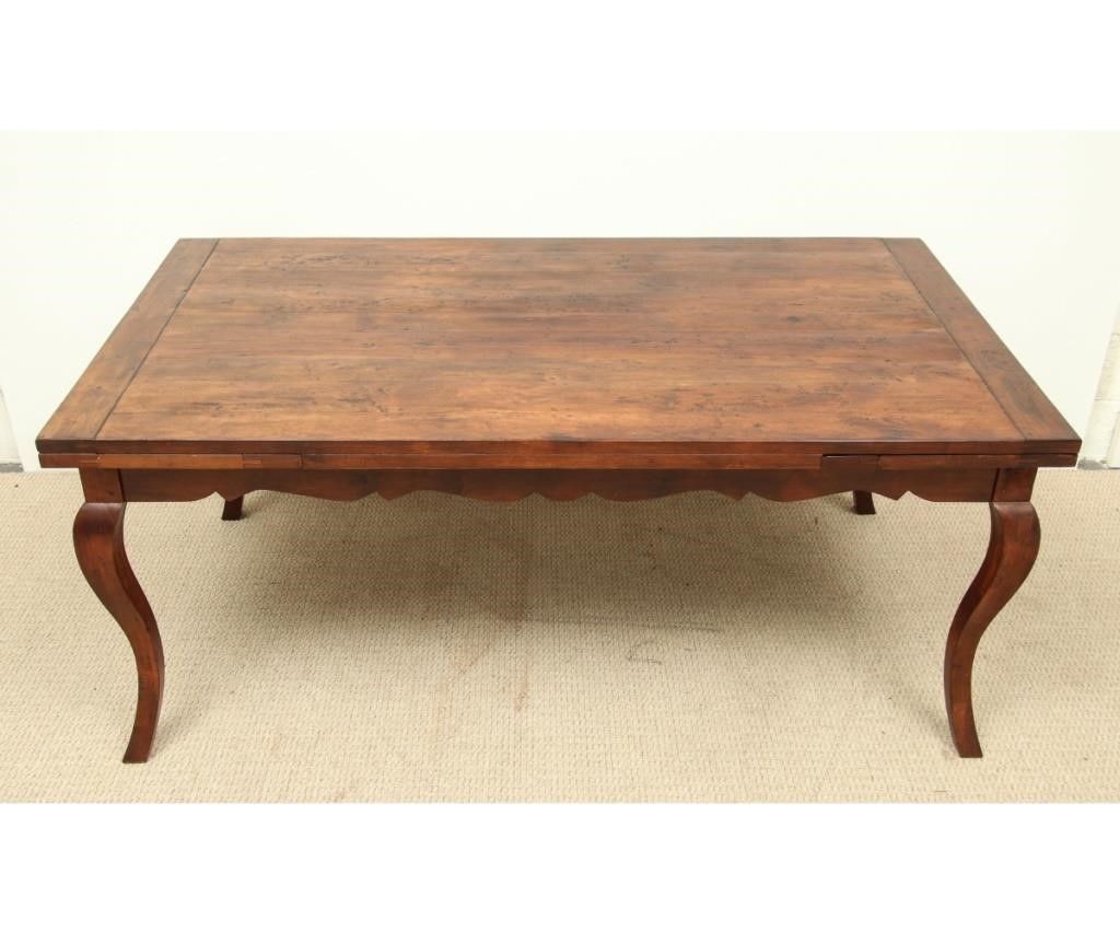 Appraisal: Guy Chaddock large French Provincial fruitwood extention table with cabriole