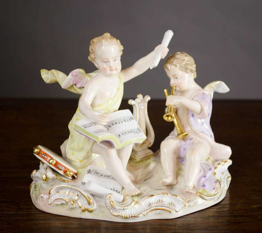 Appraisal: MEISSEN PORCELAIN FIGURAL GROUP depicting two seated cherub figures with