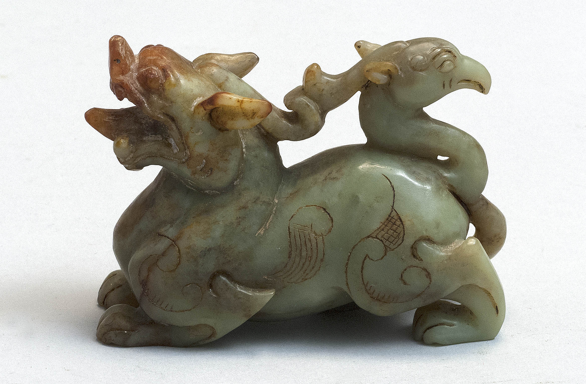 Appraisal: MOTTLED GREEN JADE FIGURE OF A CHIMERA th CenturySuggesting half-lion