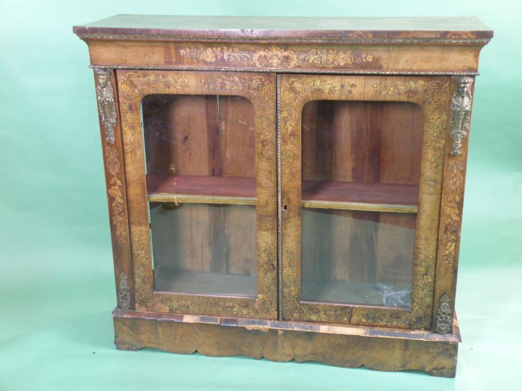 Appraisal: A Victorian walnut and marquetry pier cabinet with gilt metal