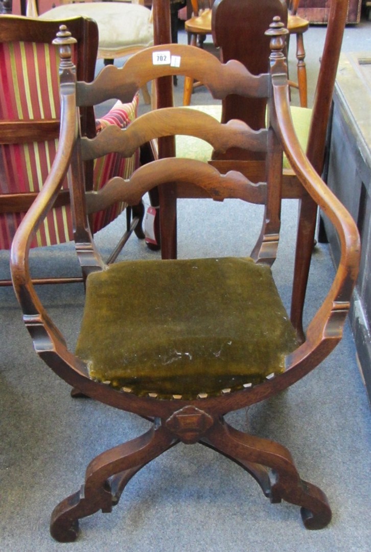 Appraisal: A pair of th century Italian walnut framed open armchairs