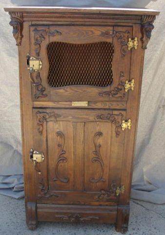 Appraisal: Victorian Oak Raised Panel and Carved Ice Box From a