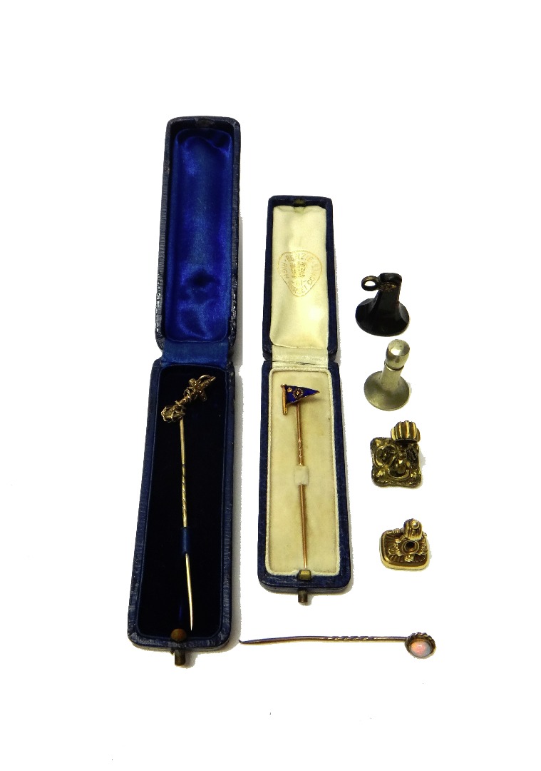 Appraisal: A gold and blue enamelled stick pin designed as a