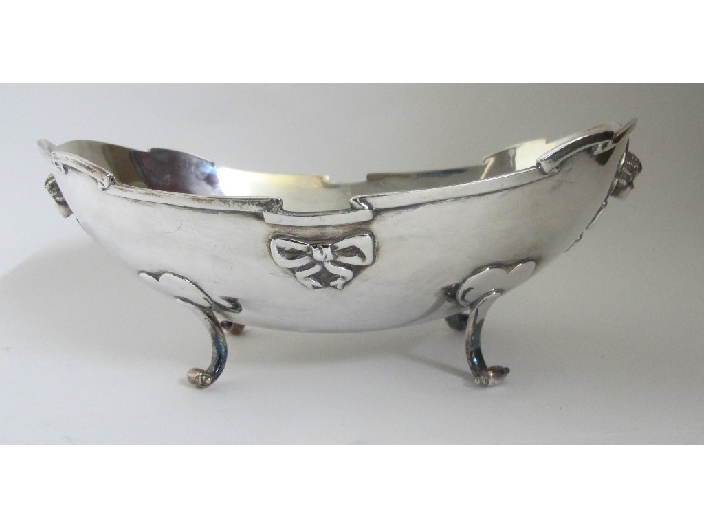 Appraisal: A silver fruit bowl of oval form on four scroll