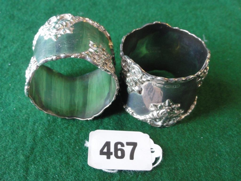 Appraisal: A pair of silver napkin rings with rose engraving stamped