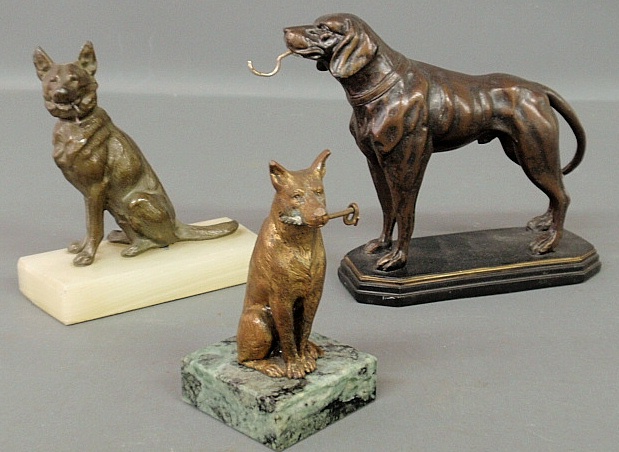 Appraisal: - Two cast metal seated dog form watch holders largest