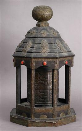 Appraisal: BURMESE BRASS-MOUNTED BLACK-PAINTED WOOD OCTAGONAL TEMPLE CHIME The rotating bell