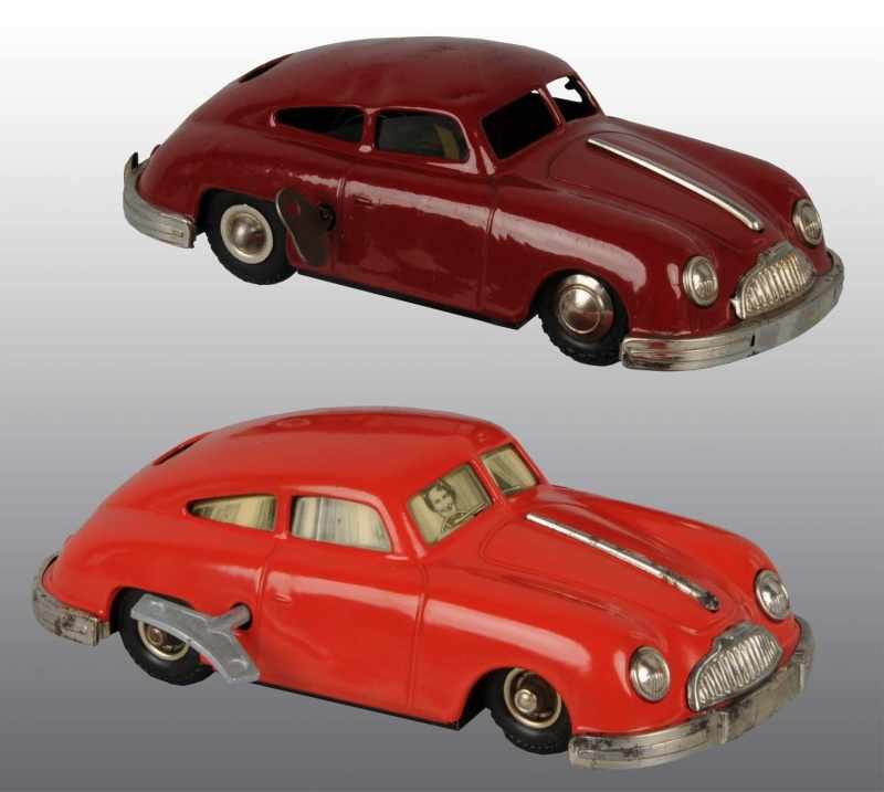 Appraisal: Lot of Tin Porsche Automobile Wind-Up Toys Description German Made