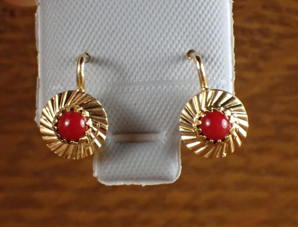 Appraisal: PAIR OF CORAL AND EIGHTEEN KARAT GOLD EARRINGS each lever