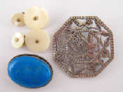 Appraisal: A mixed lot comprising two white metal tests silver brooches