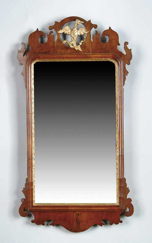 Appraisal: AMERICAN CHIPPENDALE MAHOGANY LOOKING GLASS Crest with gilt spread wing