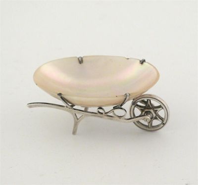 Appraisal: An Edwardian novelty dish in the form of a wheelbarrow