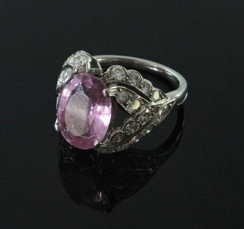 Appraisal: A pink topaz and diamond cocktail ring the principal oval