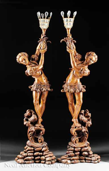 Appraisal: A Pair of Italian Rococo-Style Carved Blackamoor Torch res probably