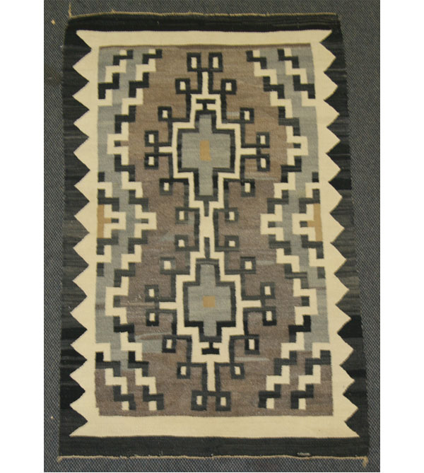 Appraisal: Two hand loomed Navajo rugs shaded monochromatic geometrics Largest x