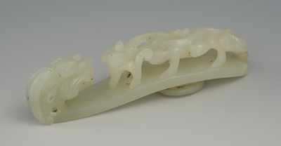 Appraisal: A Carved Nephrite Belt Hook Carved nephrite jade in a