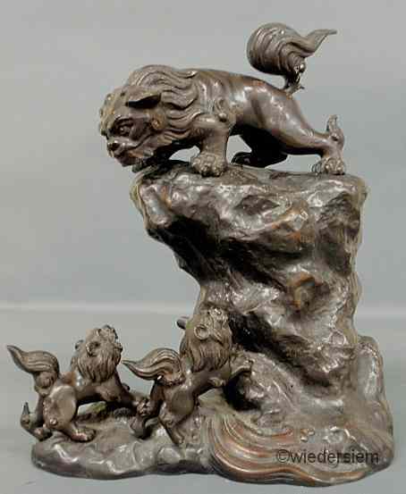 Appraisal: Asian bronze figural group with three applied Foo dogs and