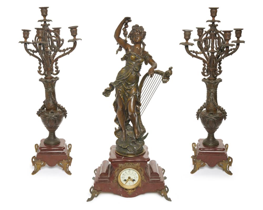 Appraisal: A French mantle clock and garniture set First-quarter th Century