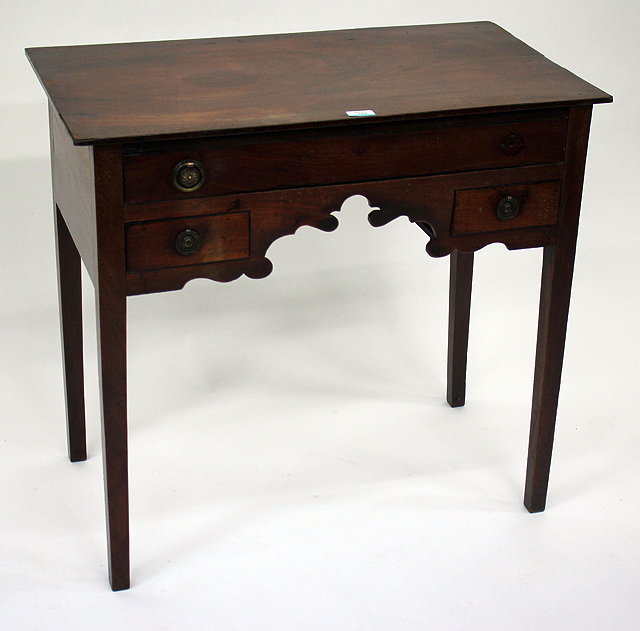 Appraisal: A VICTORIAN MAHOGANY LOW BOY with a long frieze drawer