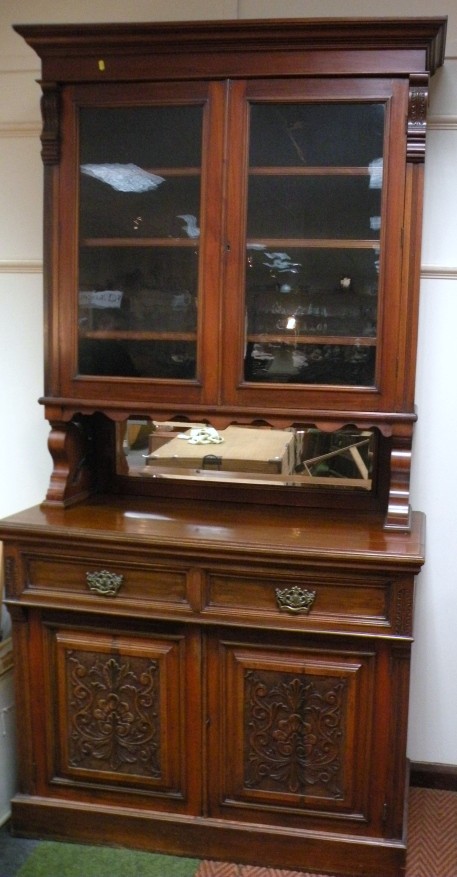 Appraisal: A late Victorian mahogany bookcase the upper section with a