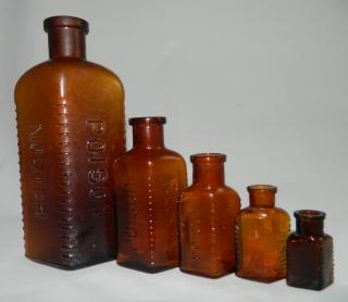 Appraisal: Amber poison bottles Poison- amber poison bottles three corners have