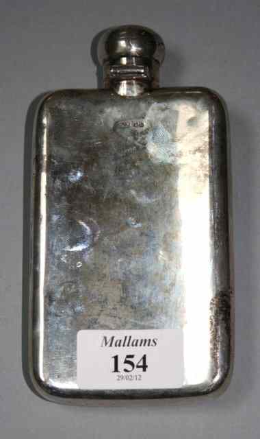 Appraisal: A VICTORIAN SILVER HIP FLASK with a curved rectangular body