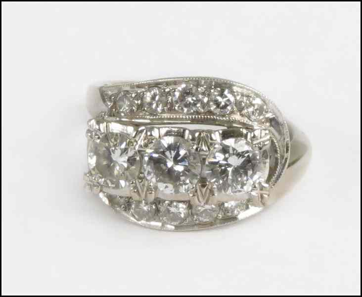 Appraisal: DIAMOND AND KARAT WHITE GOLD RING Three round briliant diamonds