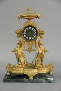 Appraisal: French style mantle clock with winged Griffin supports and enameled