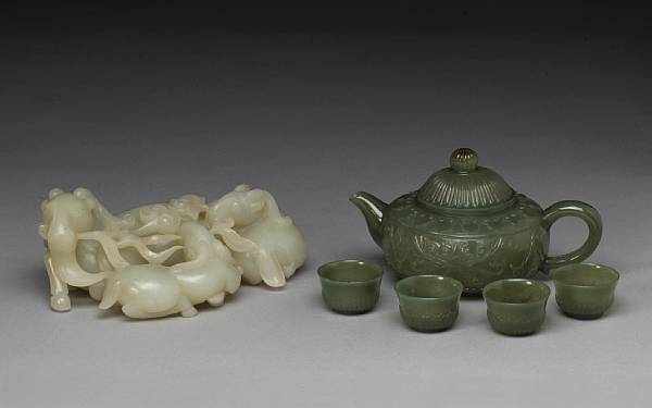 Appraisal: A pale greenish white jade group of three auspicious rams