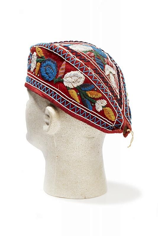 Appraisal: Glengarry Iroquois Cap Glengarry Iroquois cap with beaded floral decoration