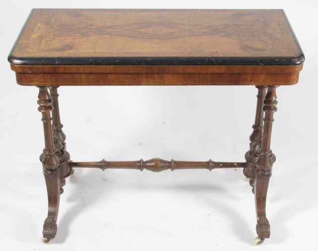 Appraisal: A late Victorian figured walnut card table with ebonised border