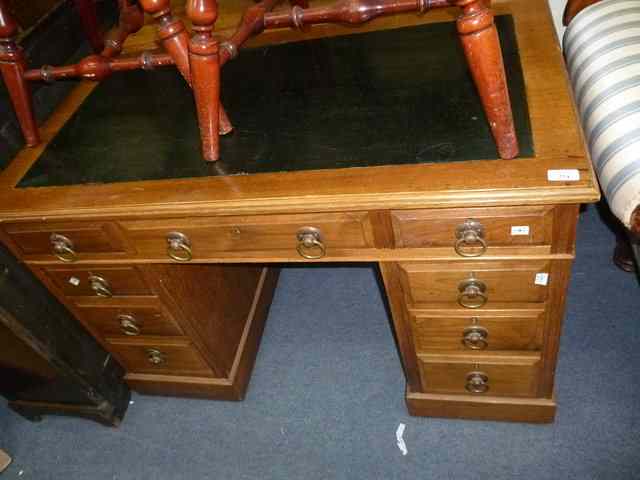 Appraisal: A VICTORIAN PEDESTAL DESK the black canvas inset top over