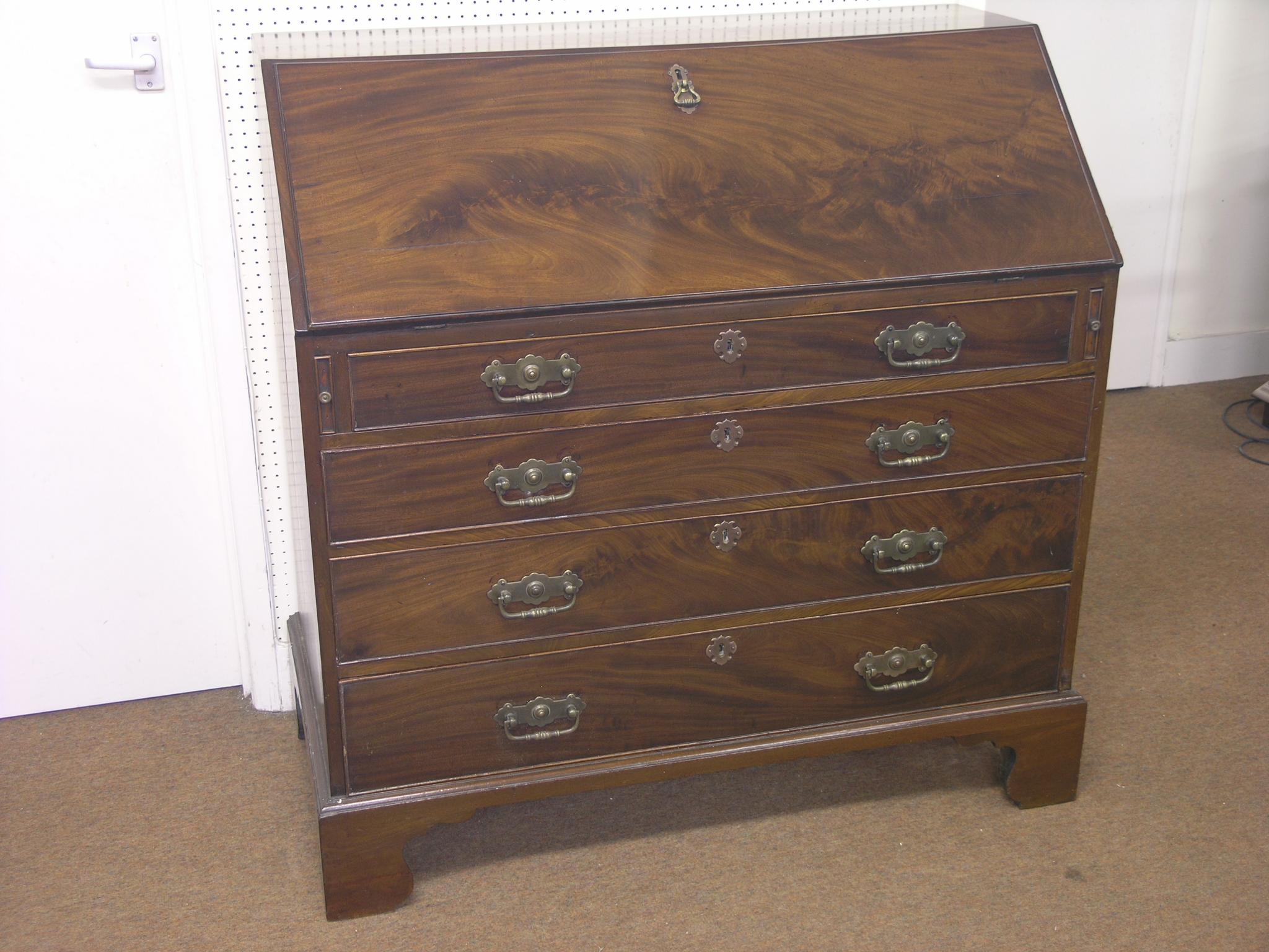 Appraisal: A George III mahogany bureau enclosed fittings consisting of central