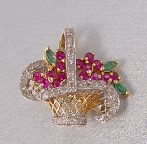 Appraisal: DIAMOND RUBY AND EMERALD BASKET PIN ENHANCER K yellow and