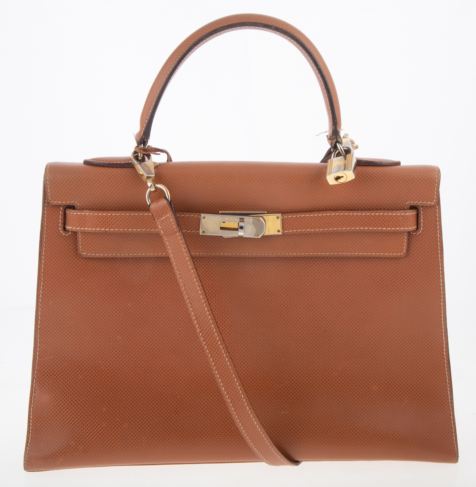 Appraisal: KELLY-STYLE TOBACCO LEATHER HANDBAG in H in W in D